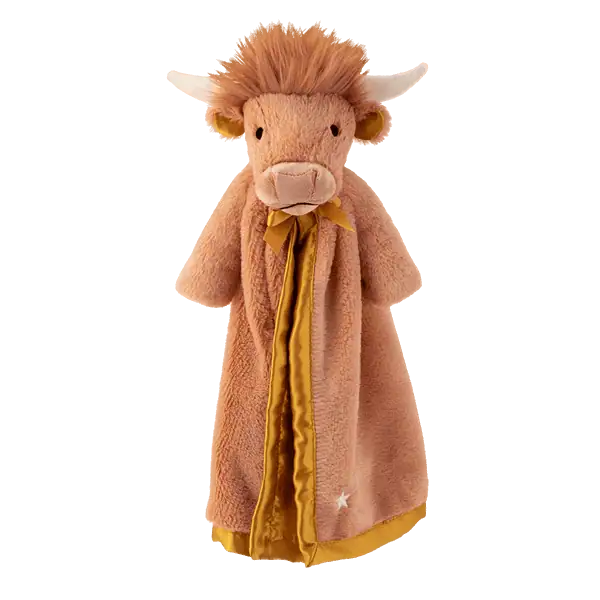 Tan plush Highland cow with long russet hair, cream horns and snout, wearing a mustard-yellow satin-trimmed blanket, Hamish the Highland Cow Scentsy Blankie Buddy