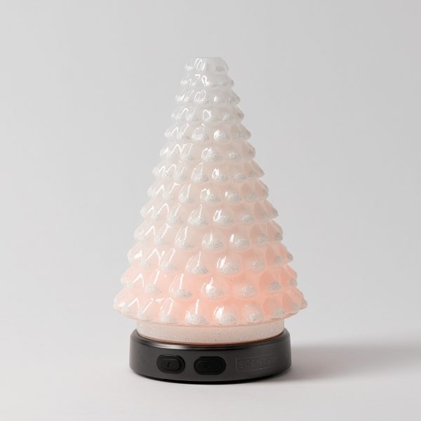 Pale pink ceramic diffuser shaped like a textured pine tree with pearlescent glitter accents, mounted on a black base with touch controls, the Aurora Frost - Scentsy Diffuser