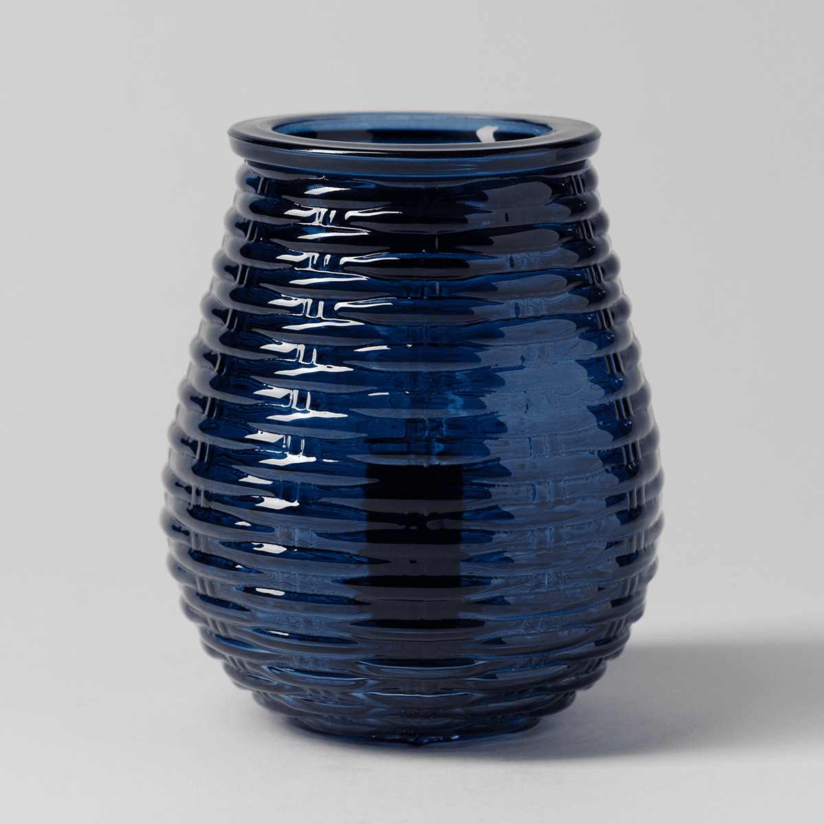 Deep blue glossy ceramic warmer with horizontal ripple texture throughout, the Azure Ripples Scentsy Warmer