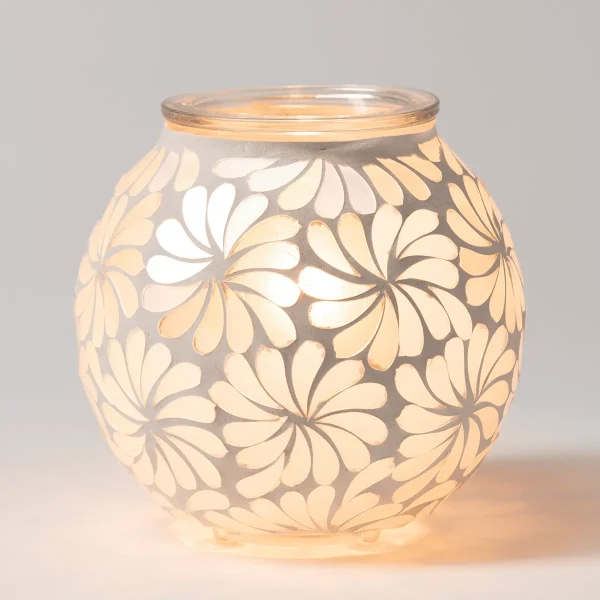 Rounded glass warmer with an all-over daisy flower pattern in cream and white tones that glow warmly when lit, the Sky Blossom Scentsy Warmer