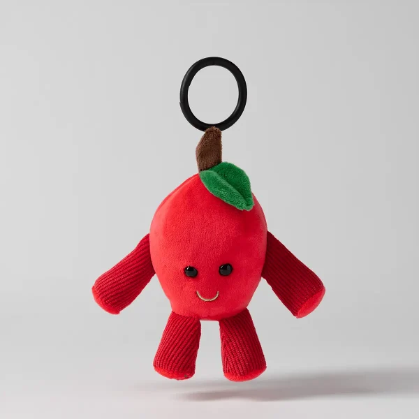 Soft plush apple toy in bright red with a green leaf, brown stem, and a cheerful embroidered face, equipped with a black clip attachment, Tart the Apple Scentsy Buddy Clip