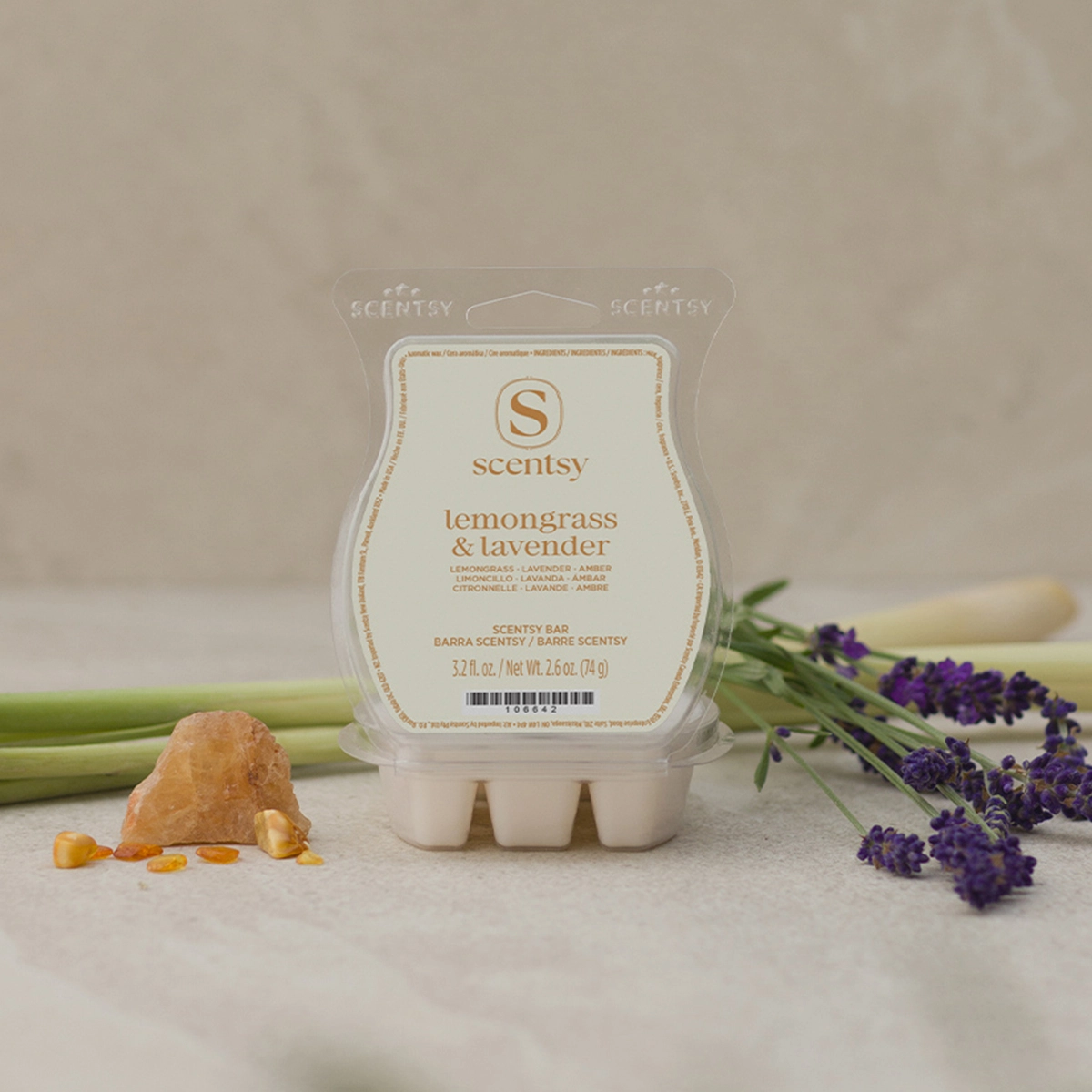 Scentsy Bar in Lemongrass & Lavender fragrance in a clear clamshell package, displayed with fresh lavender sprigs and lemongrass