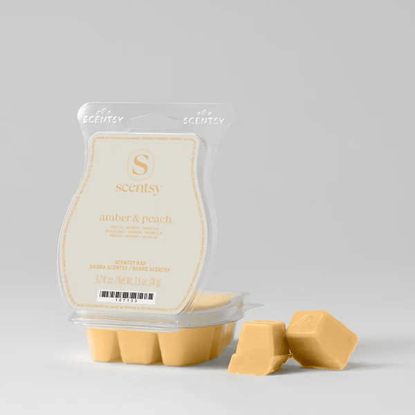 Amber & Peach Scentsy Bar - Pale yellow Scentsy Bar wax in clear plastic clamshell packaging labeled Amber & Peach, with three wax cubes displayed separately in front