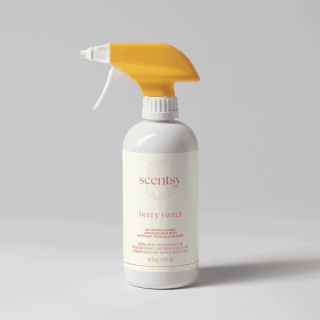 White spray bottle with gold trigger and cap, labeled Scentsy Berry Sweet Bathroom Cleaner, 16 fl oz