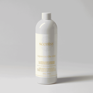 White plastic bottle with white screw cap containing Squeeze the Day All-Purpose Concentrate, 24 fl oz, with gold text and branding on cream-coloured label