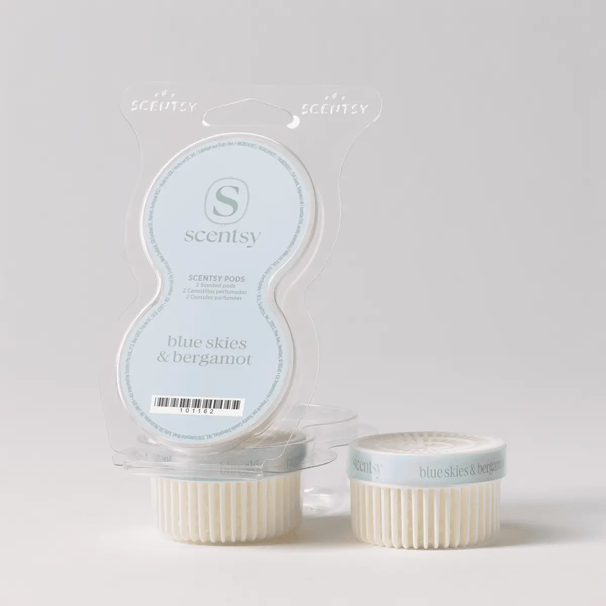 Blue Skies & Bergamot Scentsy Pods - Clear plastic clamshell packaging containing two cream-coloured ridged Scentsy Pods with light blue labels reading "blue skies & bergamot", the Blue Skies & Bergamot Scentsy Pods