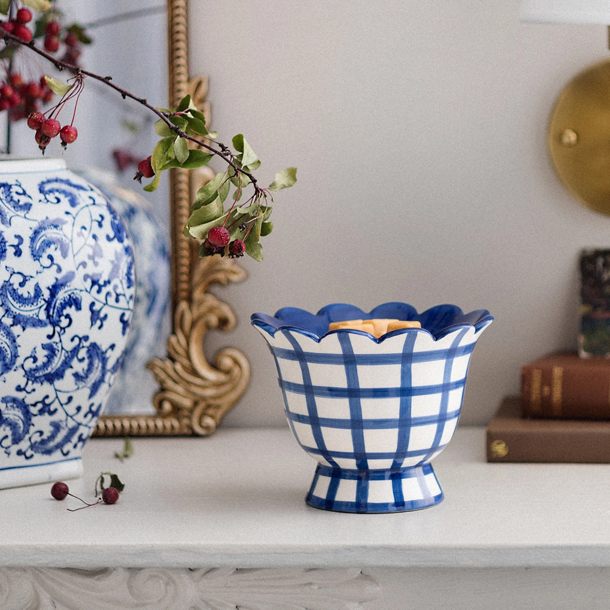 Pedestal-style ceramic warmer with a scalloped rim, blue and white gingham pattern, and warm gold interior, the Bluebell Gingham Scentsy Warmer