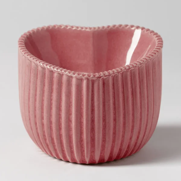 Pink ribbed ceramic warmer with a curved, organic silhouette and decorative rope trim around the rim, the Heart of Hope Scentsy Warmer