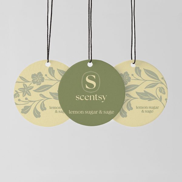 Lemon Sugar & Sage Scent Circle 3-pack - Three circular hanging Scent Circles with black cords: two pale yellow with grey botanical motifs, one sage green with the Scentsy logo, all printed with "lemon sugar & sage" text, the Lemon Sugar & Sage Scent Circle 3-pack