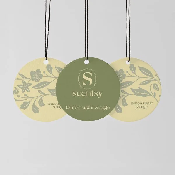 Lemon Sugar & Sage Scent Circle 3-pack - Three circular hanging Scent Circles with black cords: two pale yellow with grey botanical motifs, one sage green with the Scentsy logo, all printed with "lemon sugar & sage" text, the Lemon Sugar & Sage Scent Circle 3-pack
