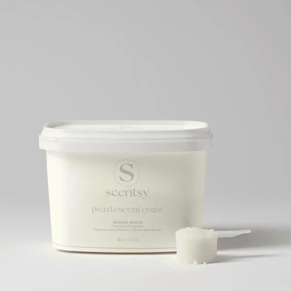 Pearlescent Coast Washer Whiffs Tub - Cream-coloured tub of Pearlescent Coast Washer Whiffs with white lid and measuring scoop, containing laundry fragrance product