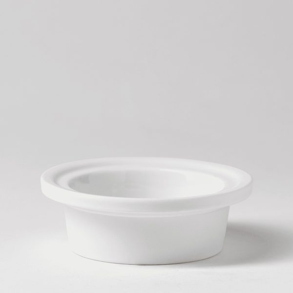 White ceramic warmer dish with a wide fluted rim and shallow circular well, the Fluted Glow Replacement Dish