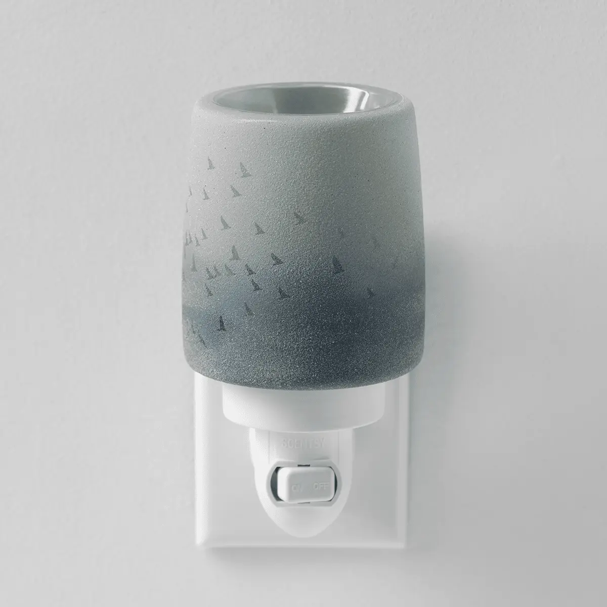 Textured grey ceramic mini warmer with an ombre gradient and small triangle motifs, wall-plug base with toggle switch, the Waves & Wings Mini Scentsy Warmer
