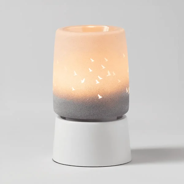 Waves & Wings Mini Scentsy Warmer with Tabletop Base - Cylindrical ceramic warmer with a white base, grey textured middle band, and warm-glowing cream upper section with white bird silhouettes in flight, the Waves & Wings Mini Scentsy Warmer with Tabletop Base