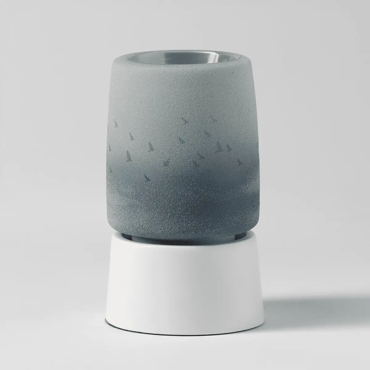Grey speckled ceramic mini warmer with subtle bird silhouettes, white cylindrical tabletop base, the Waves & Wings Mini Scentsy Warmer