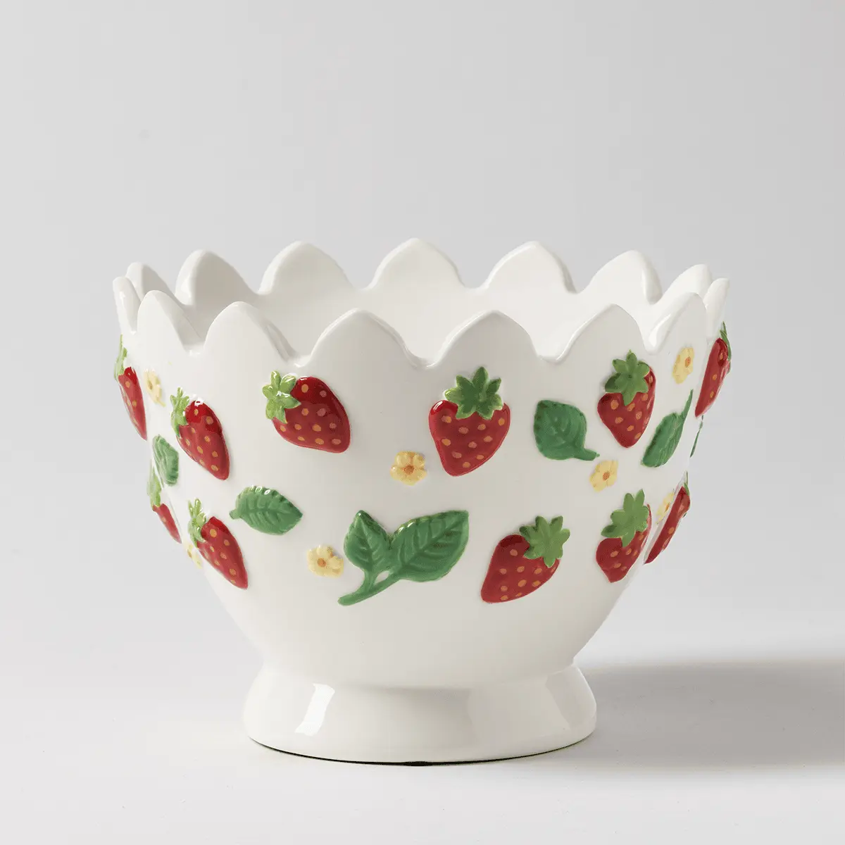 Cream ceramic warmer with a scalloped rim and pedestal base, decorated with red strawberries, green leaves, and small yellow flowers, the Strawberry Garden Scentsy Warmer