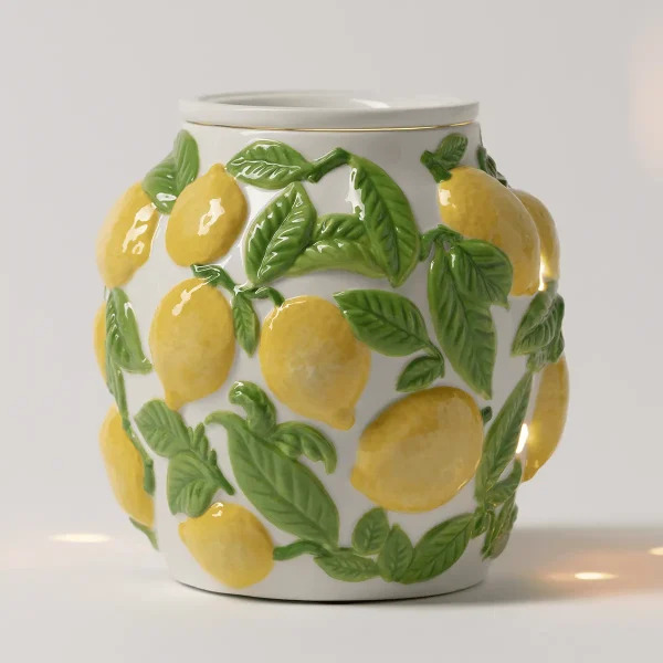 Ceramic warmer with a cream-coloured body decorated with dimensional yellow lemons and green leaves, gold trim, and a curved lid, the Amalfi Limone Scentsy Warmer
