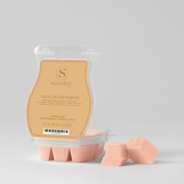 Pale pink wax bar segments in a clear clamshell with tan label showing the Scentsy logo and scent notes, the Mercato di Napoli Scentsy Bar, with two individual wax pieces displayed beside the packaging