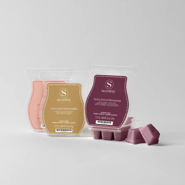 Three Scentsy wax bars in clear clamshell packaging showing coral, golden tan, and deep burgundy coloured bars with gold and burgundy labels, the Petal Collection Scentsy Bar 3-pack, with loose wax melts displayed in front