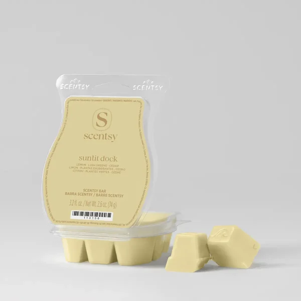 Sunlit Dock Scentsy Bar - Pale yellow Scentsy Bar wax melts in the Sunlit Dock scent, shown in clear clamshell packaging with six segmented bars below and two individual pieces displayed in front