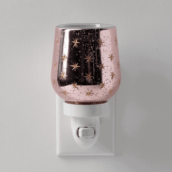 Frosted Flurry Mini Scentsy Warmer - Rose-gold glittery mini warmer with gold star pattern, black vertical stripe, and white plug-in base with on/off switch, the Frosted Flurry design