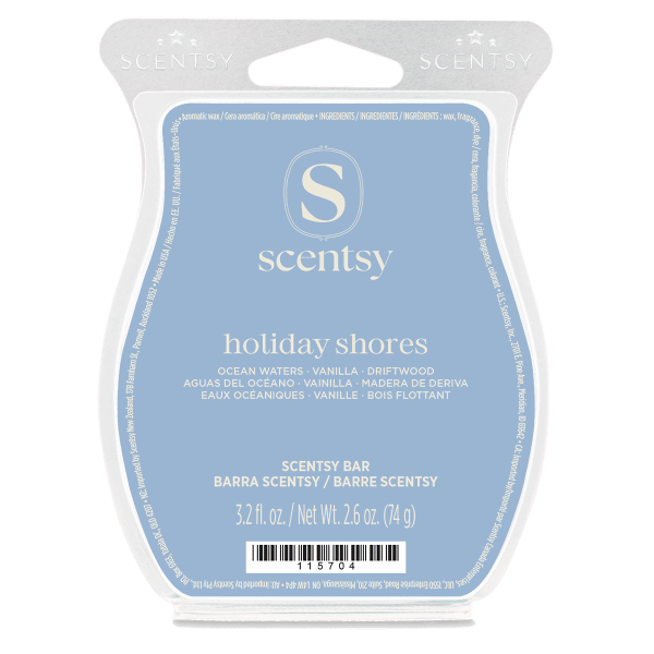 Light blue clamshell packaging with white Scentsy branding and the Holiday Shores Scentsy Bar label featuring ocean waters, vanilla, and driftwood scent notes