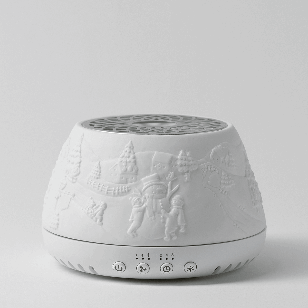 White ceramic Scentsy Air Diffuser with embossed holiday scene featuring Santa, reindeer, and winter trees, decorative geometric top, and touch controls at base