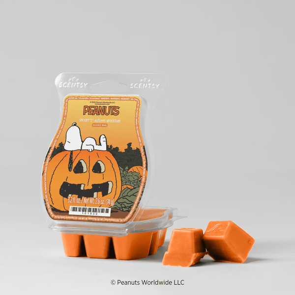 Snoopy’s Autumn Adventure Scentsy Bar in orange wax, shown in a pumpkin-shaped clear clamshell with Peanuts branding featuring Snoopy sitting on a jack-o'-lantern, accompanied by three individual orange wax cubes displayed beside the full bar.