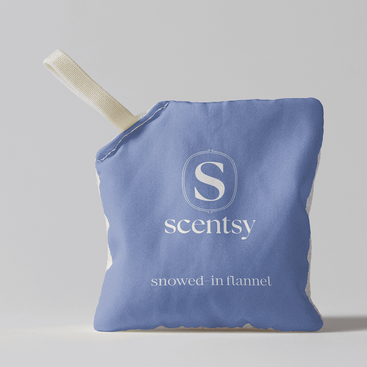 Snowed-In Flannel Scent Pak - Periwinkle blue fabric Scent Pak with cream-coloured Scentsy logo and "snowed-in flannel" text, attached to a cream grosgrain ribbon loop