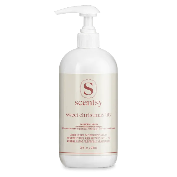 White pump bottle of Scentsy Sweet Christmas Lily Laundry Liquid concentrated detergent, 20 fl oz, with cream label and red text