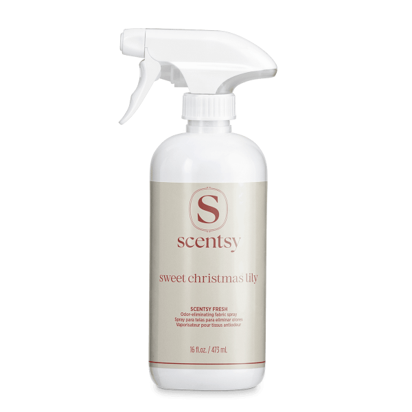 White spray bottle with trigger nozzle and cream-coloured label featuring the Scentsy logo and Sweet Christmas Lily Scentsy Fresh text, 473 ml fabric spray for odour elimination