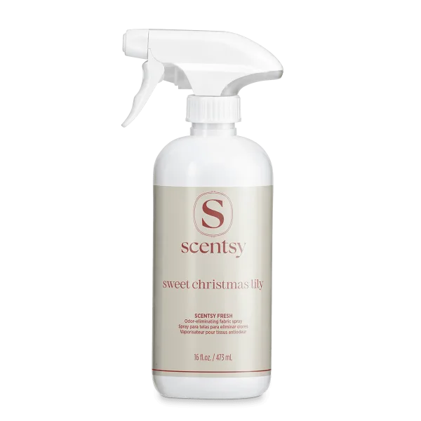White spray bottle with trigger nozzle and cream-coloured label featuring the Scentsy logo and Sweet Christmas Lily Scentsy Fresh text, 473 ml fabric spray for odour elimination
