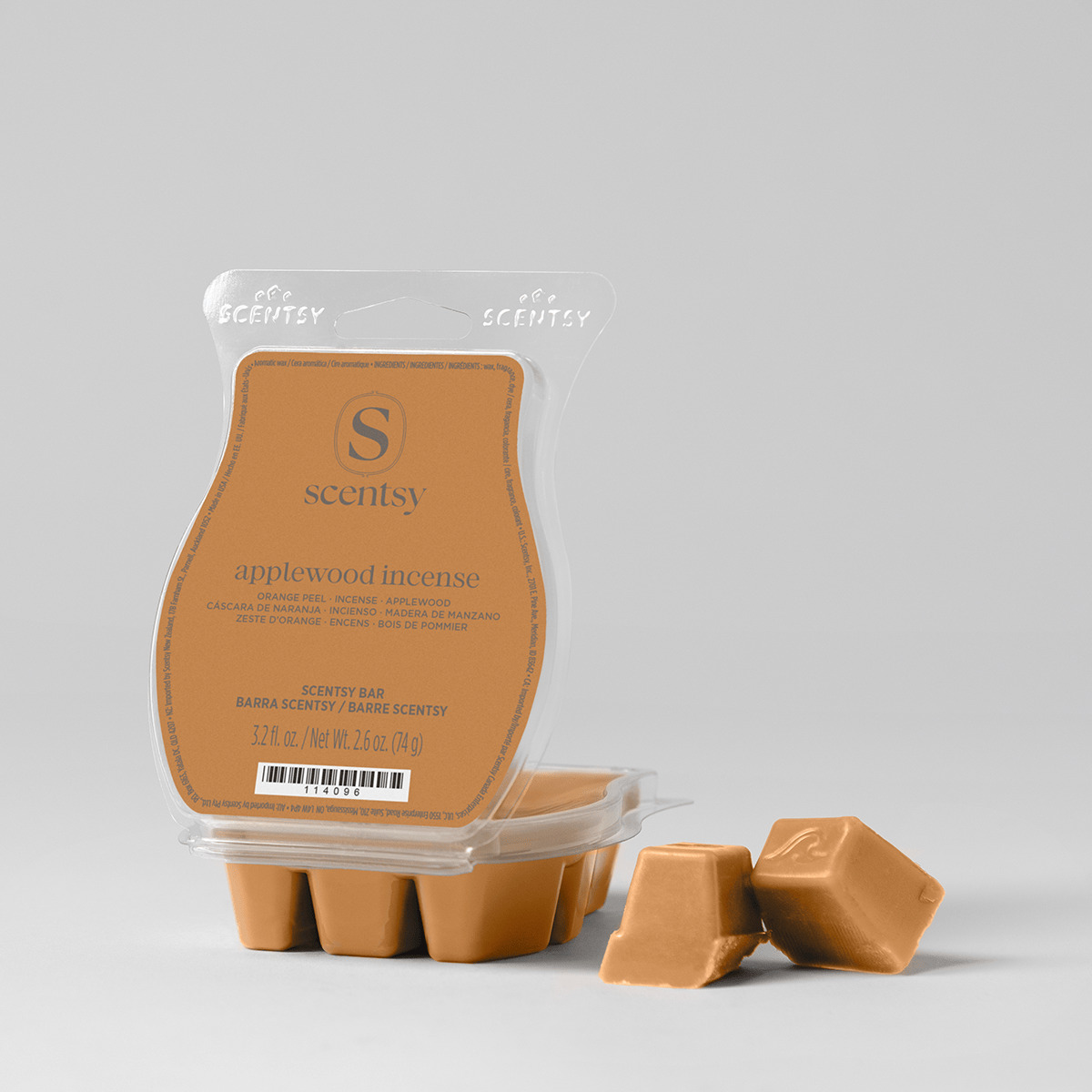Tan-coloured wax bar segments in a clear clamshell package labelled Applewood Incense Scentsy Bar, with three pieces displayed separately in front