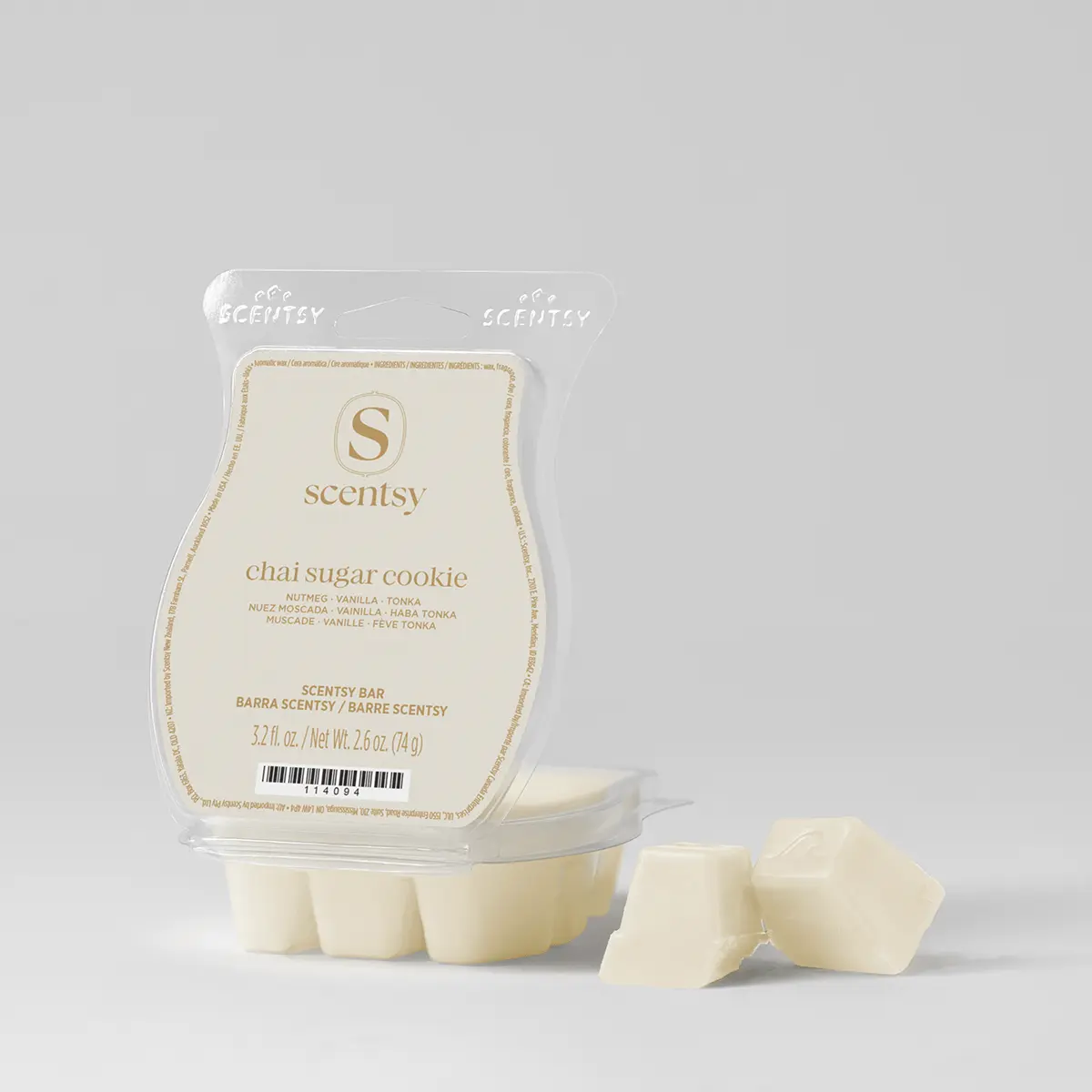 Cream-coloured wax bar in clear plastic clamshell packaging with gold text reading "Chai Sugar Cookie Scentsy Bar", showing six wax cubes in the tray and three pieces separated below