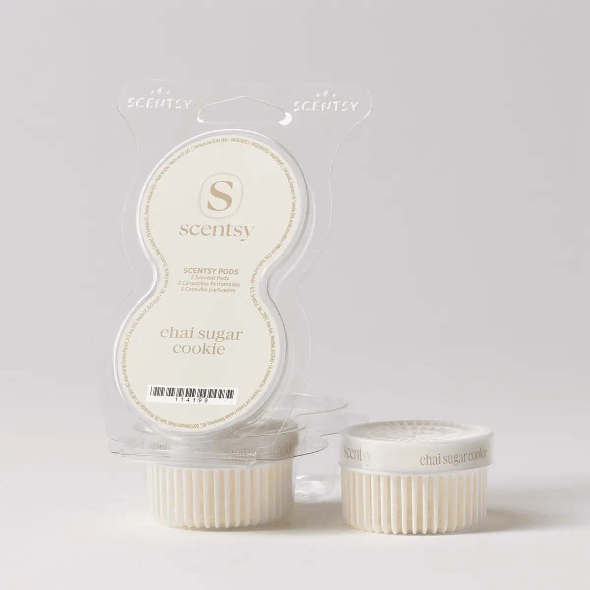 Cream-coloured Scentsy Pods in clear clamshell packaging showing two scented pods and their individual containers below, labelled Chai Sugar Cookie Scentsy Pods
