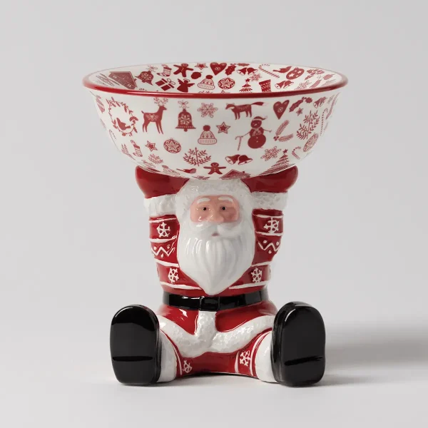 Ceramic Scentsy Warmer shaped like Santa with a white beard and red suit decorated with snowflake patterns, holding a bowl with red and cream Christmas motifs, the Christmas Keeper Scentsy Warmer