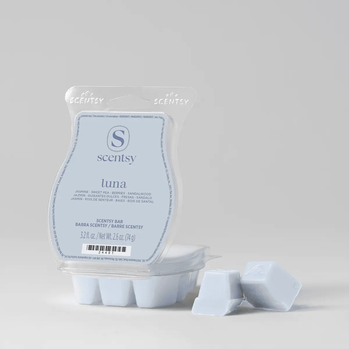 Pale blue wax cubes in a clear clamshell with a light blue label, two loose cubes beside it, from the Halloween Scentsy Bar 5-pack