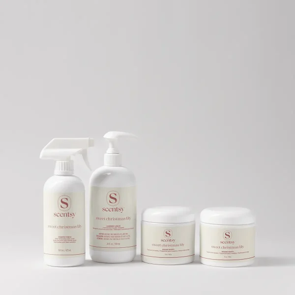 Four white Scentsy laundry products in the Sweet Christmas Lily scent, part of the Holiday Laundry Bundle: a trigger spray bottle, a pump bottle of laundry liquid, and two jars of washer whiffs, arranged in a row against a neutral background