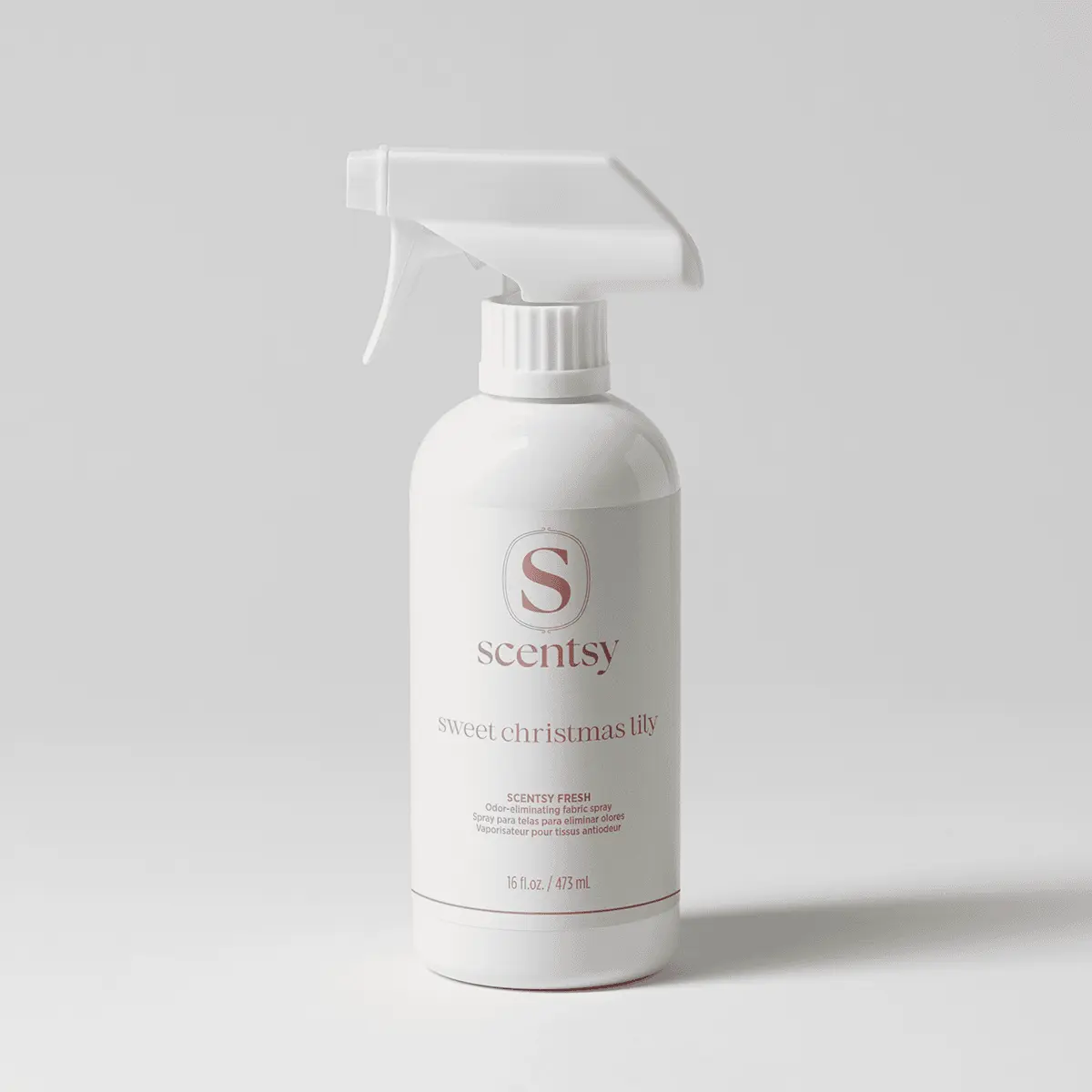 White trigger spray bottle with rose-pink lettering, the Sweet Christmas Lily Scentsy Fresh fabric spray