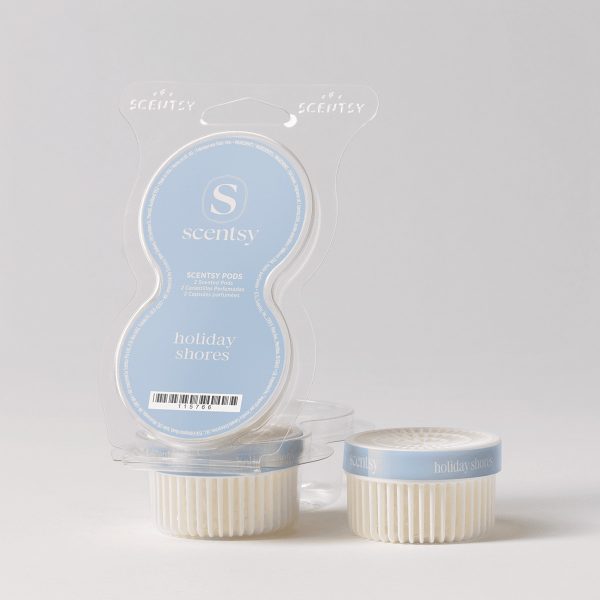 Light blue and cream Scentsy Pods packaging with two individual wax pods displayed in front, showing the Holiday Shores Scentsy Pods branding and ribbed white pod containers