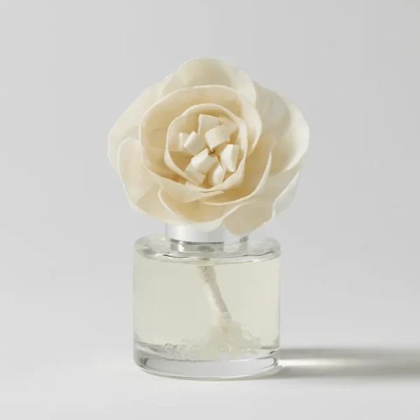 Cream-coloured rose-shaped Fragrance Flower with layered petals displayed in a clear glass vial, the Jingle Bell Blooms - Buttercup Belle Fragrance Flower