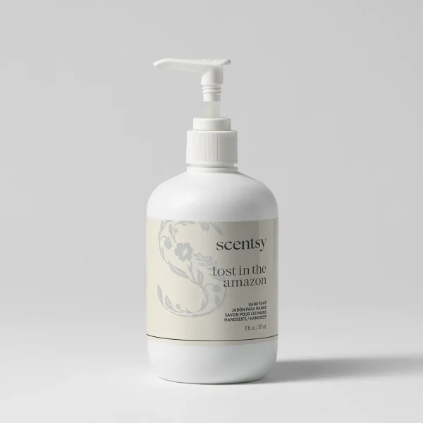 White pump-dispenser bottle of Lost in the Amazon Hand Soap with botanical illustration and multilingual labelling on cream-coloured label