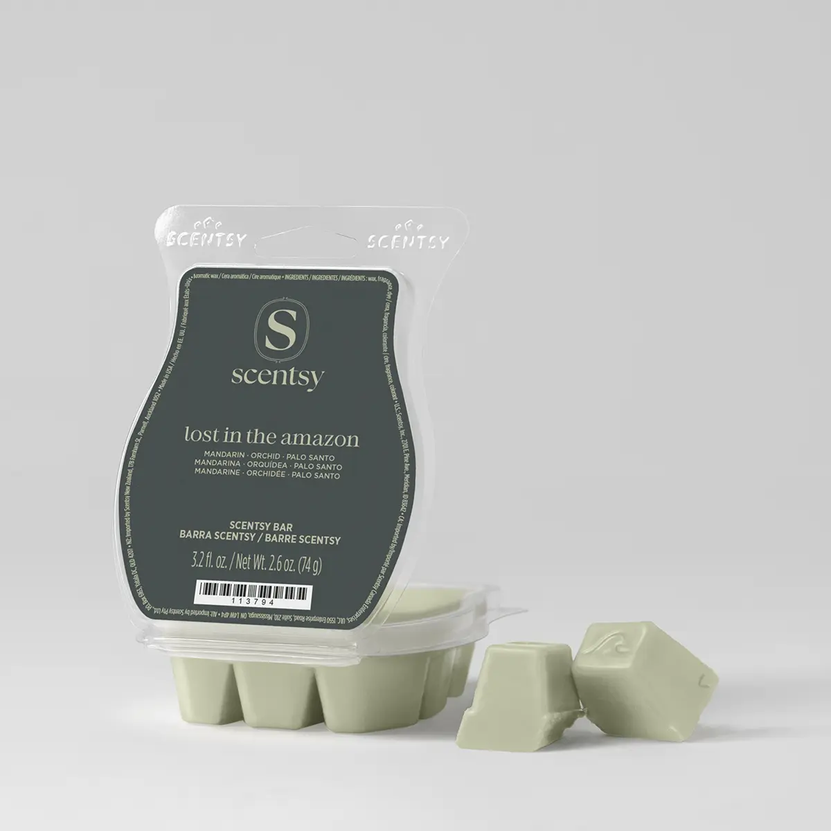 Pale sage green wax cubes beside their clear clamshell pack with a dark green label, the Lost in the Amazon Scentsy Bar