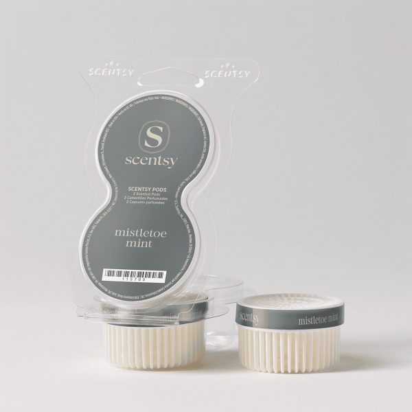 Two cream-coloured ridged Scentsy Pods with charcoal-grey bands labelled "mistletoe mint" beside their clear plastic clamshell packaging, the Mistletoe Mint Scentsy Pods