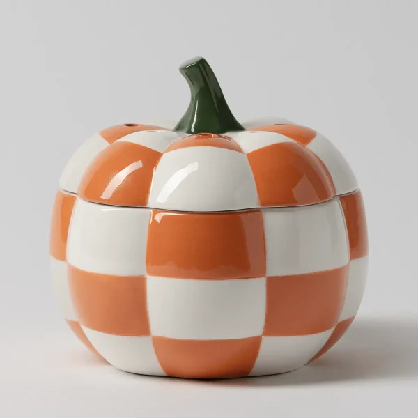 Glossy ceramic pumpkin warmer with a checkerboard pattern in orange and cream, topped with a dark green stem, the Patchwork Pumpkin Scentsy Warmer