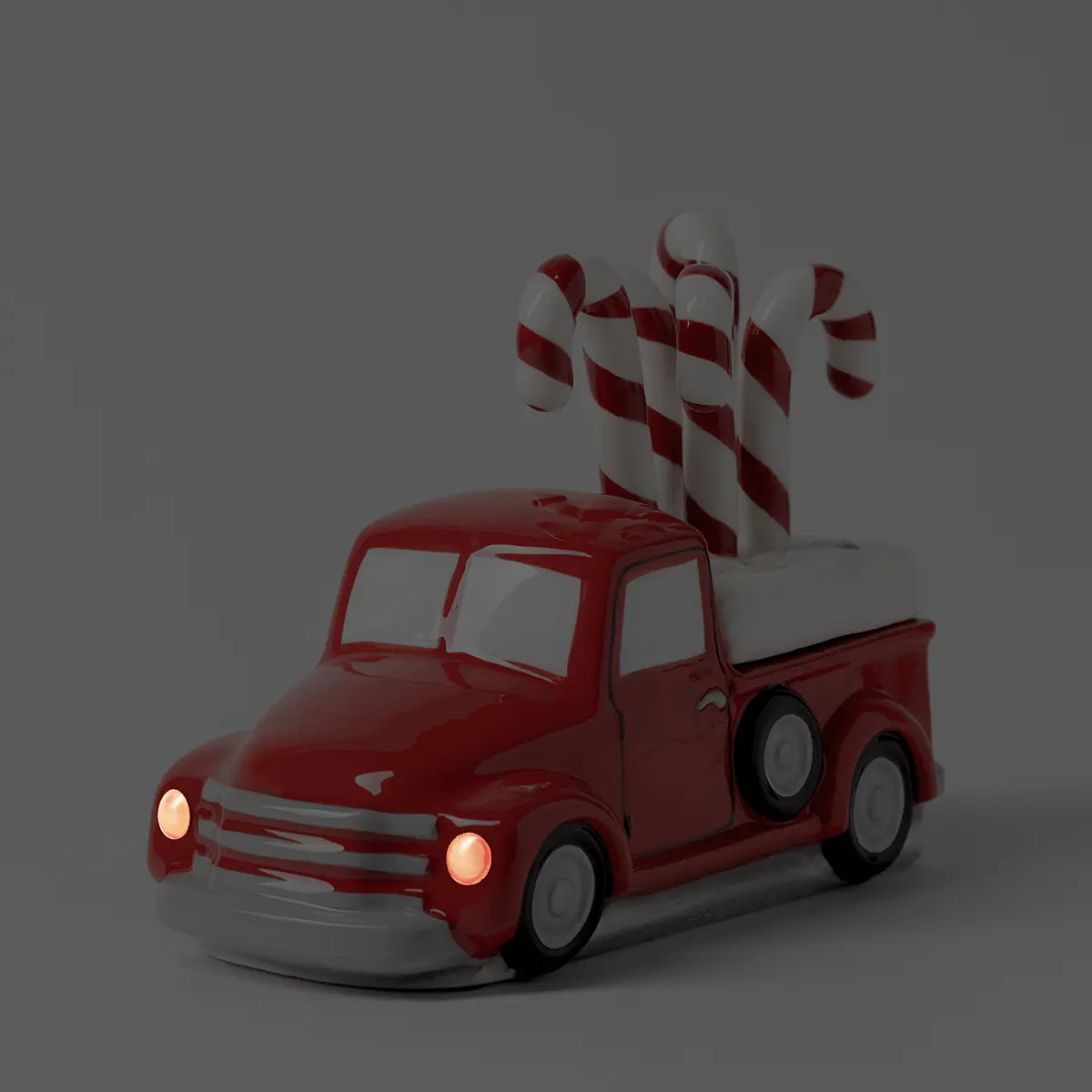 Red retro pickup truck warmer with illuminated headlights and a festive candy cane topper, the Red Retro Truck Scentsy Warmer with Candy Cane Topper