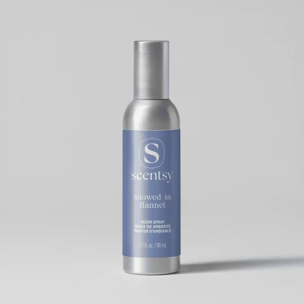 Metallic silver cylindrical room spray bottle with a blue label featuring the Scentsy logo and "Snowed-In Flannel Room Spray" text, 2.7 fl oz / 80 mL size