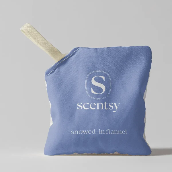 Periwinkle-blue fabric Scent Pak with cream ribbed hanging loop and embroidered Scentsy logo, labelled Snowed-In Flannel Scent Pak