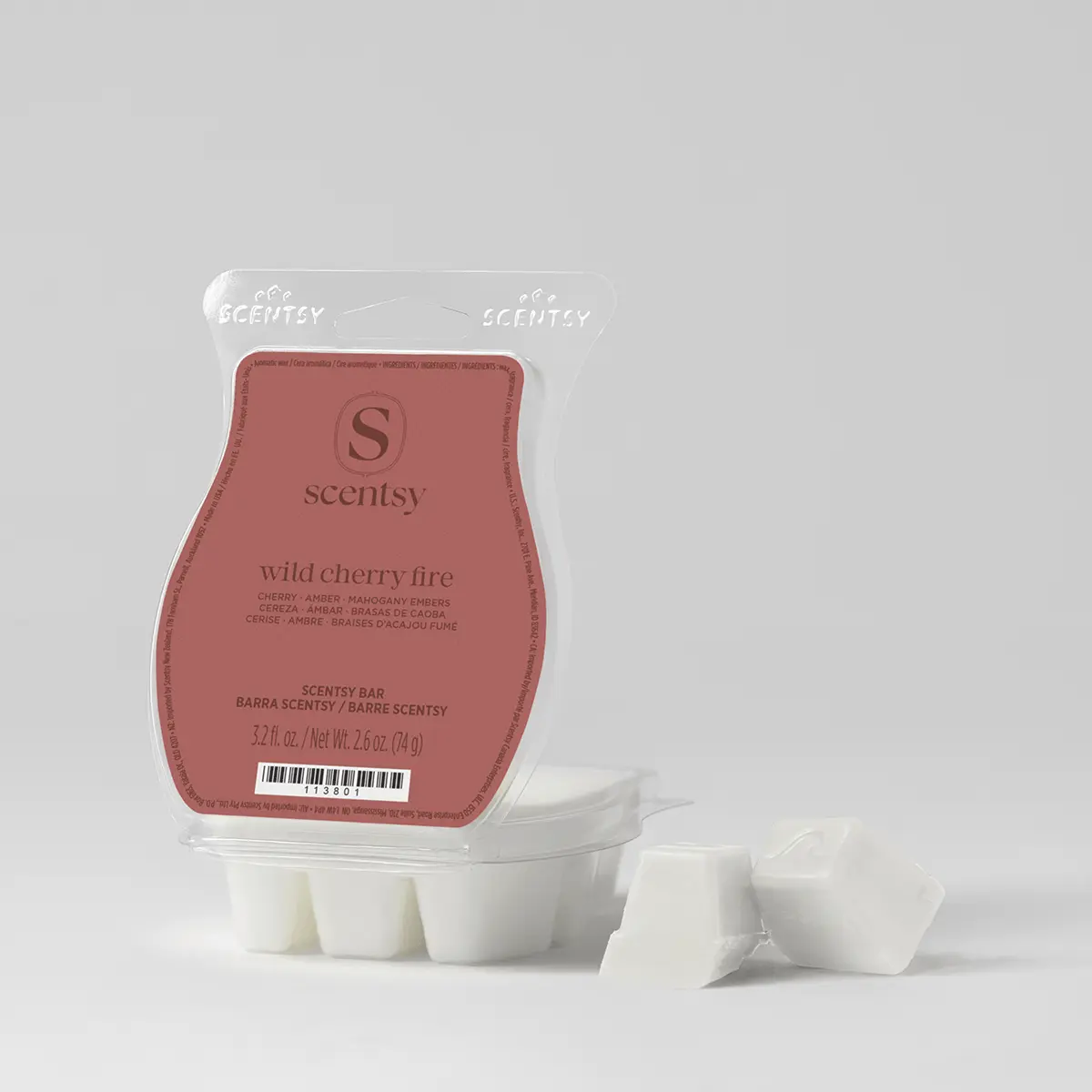Cream-coloured wax bars in a clear clamshell with a rose-pink label for Wild Cherry Fire Scentsy Bar, with three bars visible in the mould and two loose bars beside the packaging
