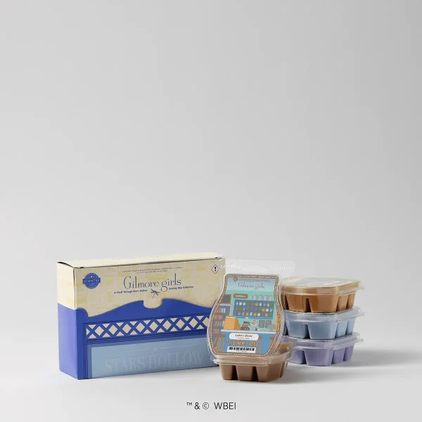 Scentsy Wax collection in a blue and cream box labeled Gilmore Girls, displayed with three stacked plastic clamshell wax bars in brown, grey, and purple, A Stroll Through Stars Hollow - Scentsy Wax Collection